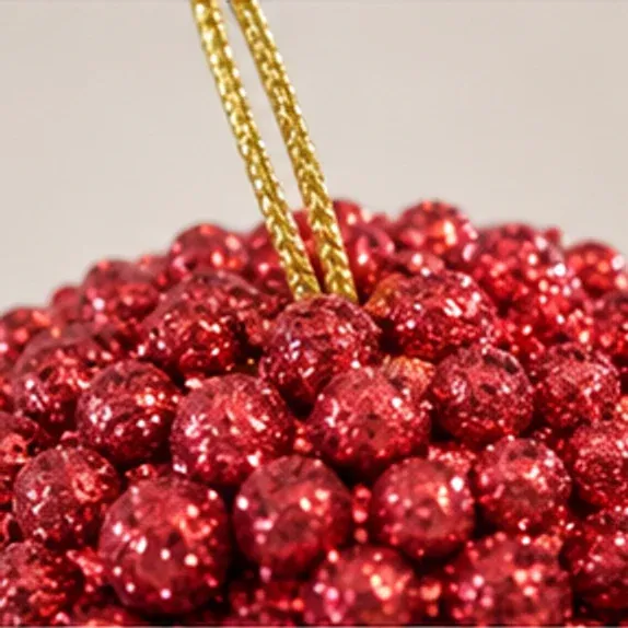 Glitterbal rood, het gouden ophangkoord