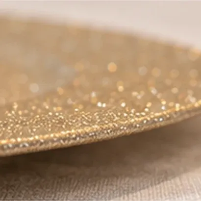 Onderbord goud glitter, de rand
